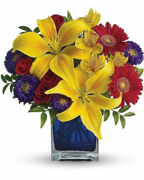 Vibrant yellow lily and red rose floral arrangement from Gurnee florist