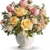 Pastel rose and tulip flower arrangement in ceramic vase