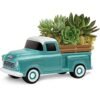 Succulent arrangement in teal pickup truck planter