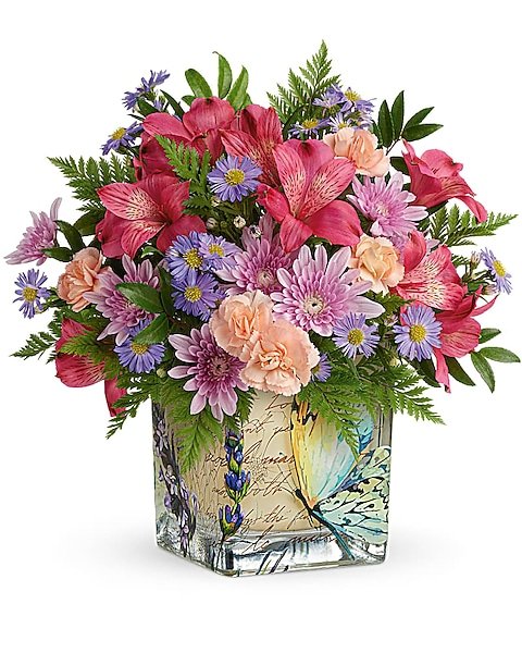 Purple and pink floral arrangement with roses and daisies for flower delivery Waukegan IL
