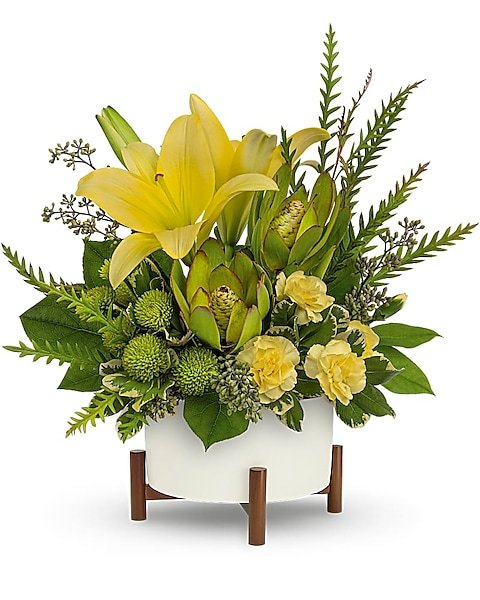 Yellow lilies with greenery floral arrangement from florist in Grayslake IL