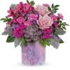 Pink roses and mixed flowers bouquet in purple vase from Gurnee flower shop