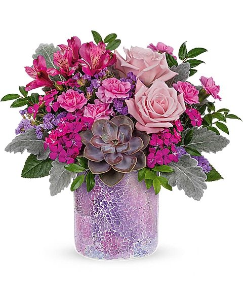 Pink roses and mixed flowers bouquet in purple vase from Gurnee flower shop