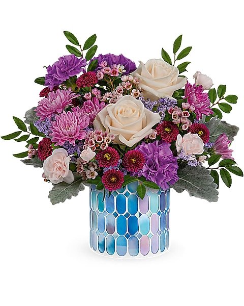 Mixed floral bouquet with roses and lilies in blue and white vase from Gurnee florist
