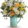 White and yellow rose floral arrangement in green mug from Gurnee flower shop