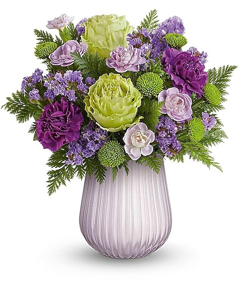 Purple roses and mixed flowers arranged in vase for flower delivery Waukegan IL
