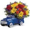 Colorful sunflower and daisy bouquet in a vintage truck vase, available for flower delivery Vernon Hills IL
