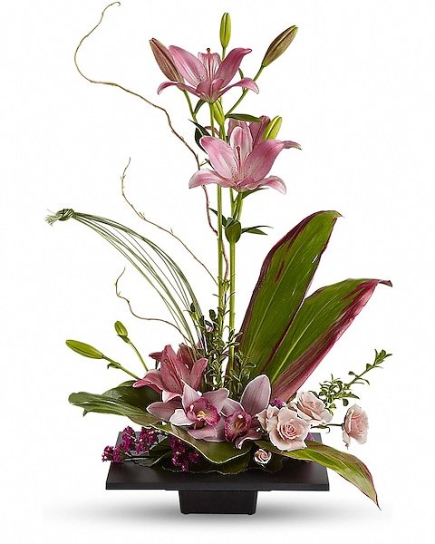 Exotic floral arrangement with pink flowers and greenery from Gurnee flower shop
