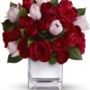 Red rose bouquet in square glass vase