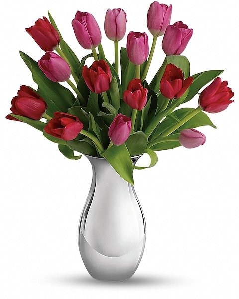 Red tulip flower bouquet in white ceramic vase