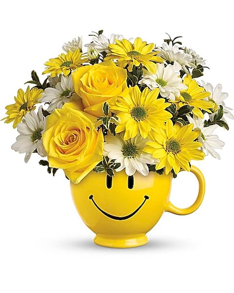 Yellow roses and daisies in smiley mug from Gurnee flower shop