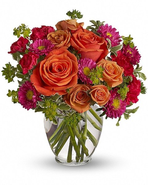 Orange rose and red mixed flower bouquet in glass vase