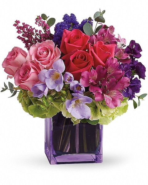 Bright floral bouquet with roses and lilies in square vase, available for delivery Grayslake