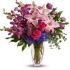 Alt: Mixed pink and purple floral bouquet in clear glass vase