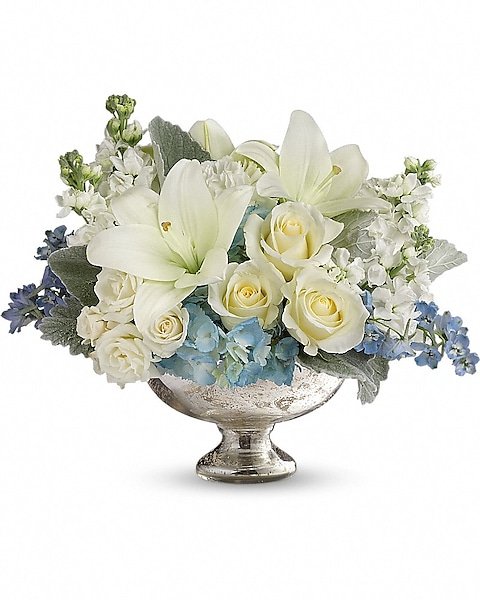 White lilies and roses with blue accents from florist in Grayslake IL