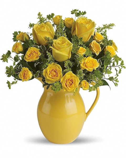 Yellow rose floral arrangement in yellow pitcher from Gurnee florist