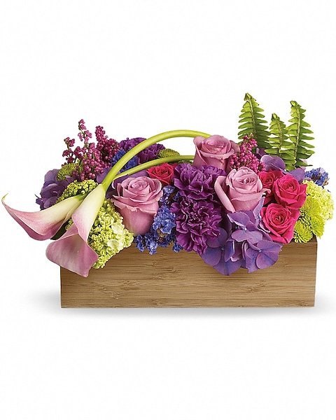 Mixed purple, pink, and red floral bouquet in a basket, available for delivery Grayslake IL
