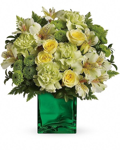White roses and yellow lilies arrangement in green vase for flower delivery Grayslake IL