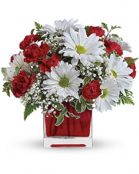 Purple floral bouquet in a red vase, available from Gurnee florist