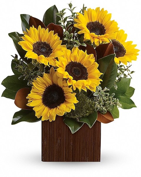 Sunflower and mixed flower arrangement in wooden container