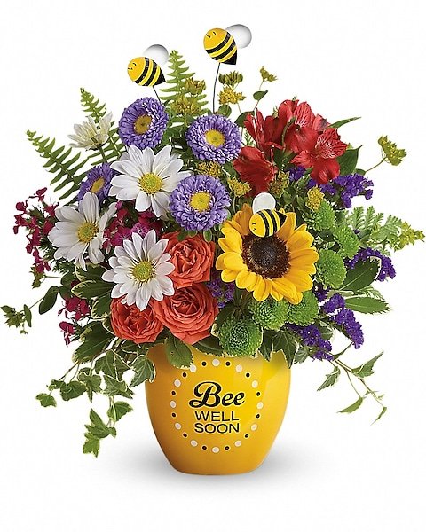 Bright mixed floral arrangement in a yellow vase, perfect for flower delivery Waukegan IL