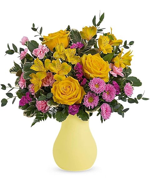 Yellow roses with purple accent flowers arranged by Gurnee florist
