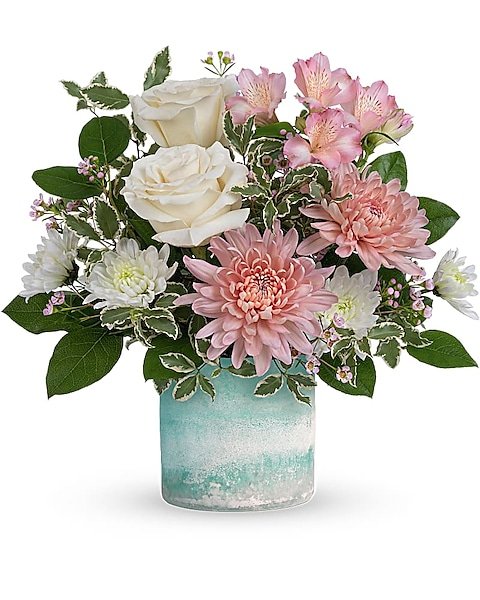 Pink and yellow roses floral arrangement from florist in Gurnee IL with cute duckling decoration