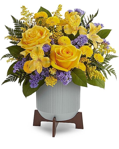 Yellow roses with purple accent flowers arranged by Gurnee florist