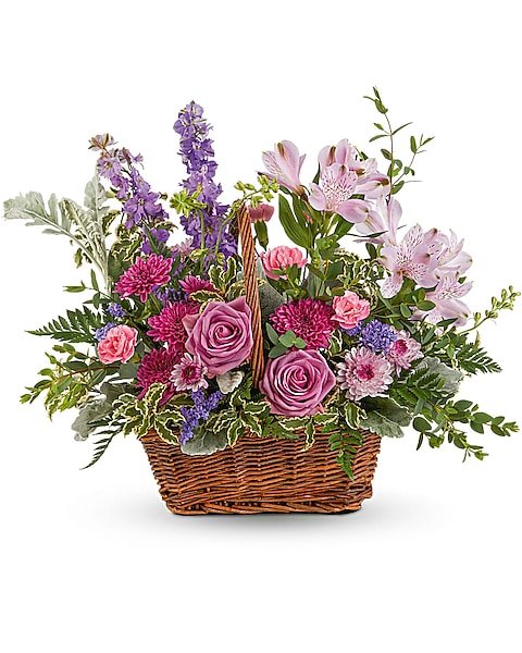 Purple and pink mixed flower basket arrangement