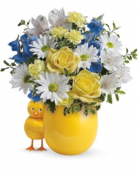 Yellow and white floral bouquet with a duckling, available for delivery in Grayslake IL