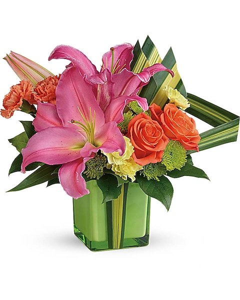 Pink lilies and white roses in a clear vase from Gurnee florist