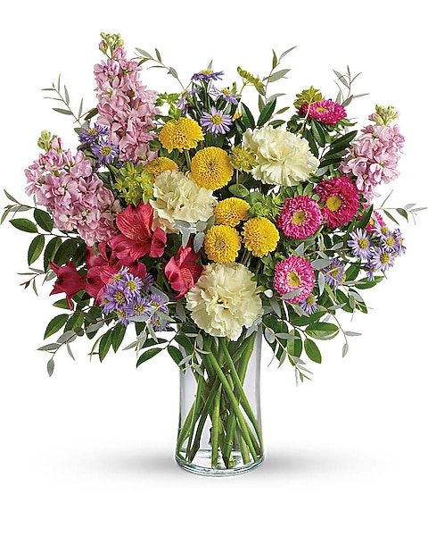 Bright mixed flower bouquet with yellow and pink blooms