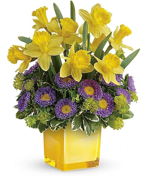 Yellow lily and purple aster bouquet in yellow vase from Gurnee flower shop