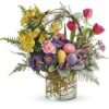 Easter themed floral arrangement with pastel eggs and flowers