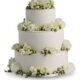 Three-tier wedding cake with white floral arrangements available in Gurnee