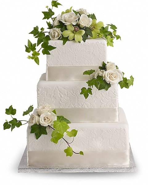 Elegant white wedding cake with floral accents available from Gurnee florist