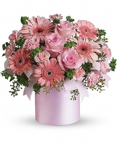Soft pink daisy and rose arrangement from elegant flower shop in Gurnee IL