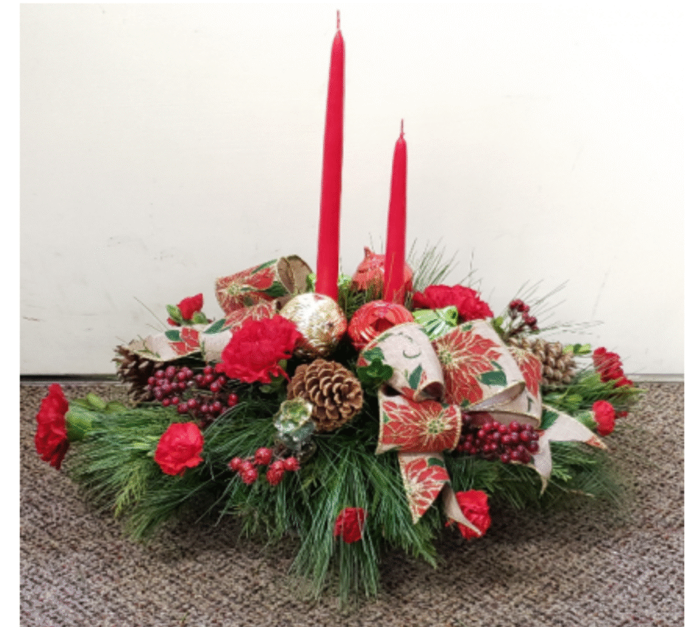 Christmas floral centerpiece with candles from florist in Grayslake IL