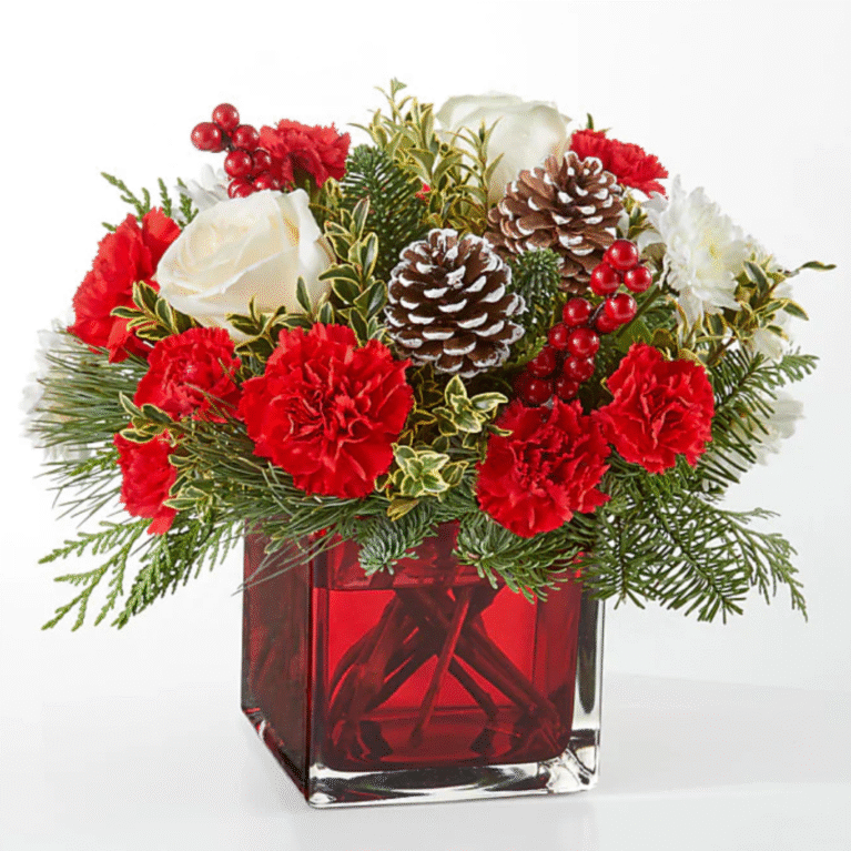 Red and white holiday bouquet with pine accents from the best florist in Gurnee IL